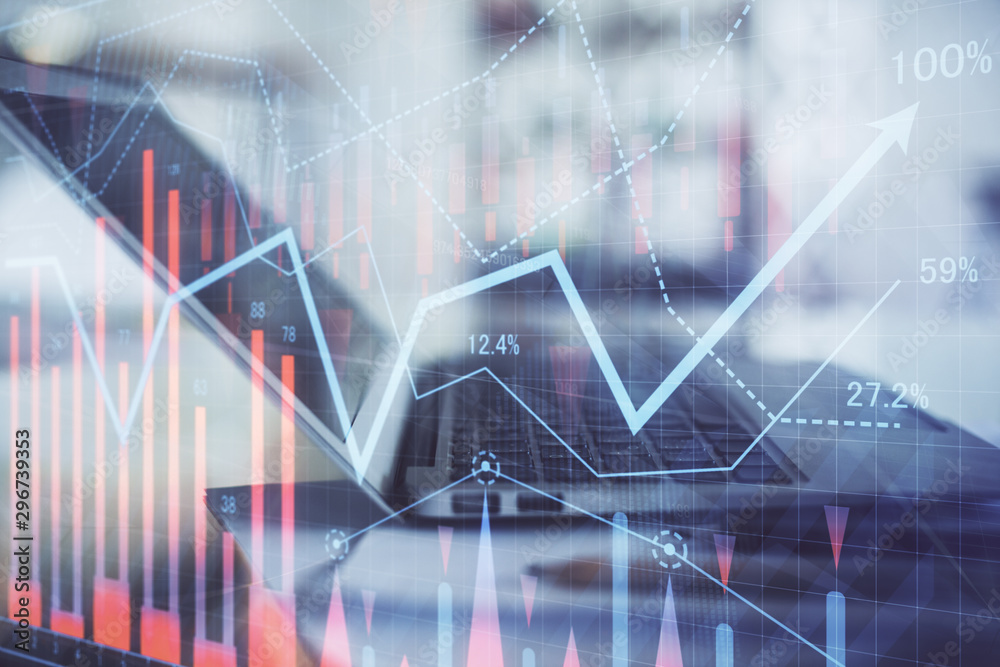 Forex graph hologram on table with computer background. Double exposure. Concept of financial markets. Forex graph hologram on table with computer background. Double exposure. Concept of financial markets.