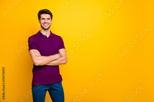 Portrait of his he nice attractive cheerful cheery content brown-haired guy folded arms copy space isolated over bright vivid shine vibrant yellow color background