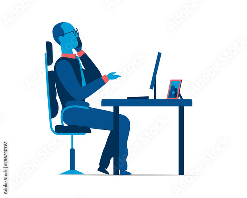 An employee works at the office desk