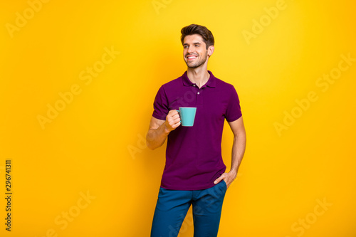 Portrait of his he nice attractive cheerful cheery content guy drinking espresso isolated over bright vivid shine vibrant yellow color background