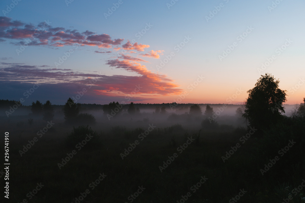 Noised Fantastic Sunset field fog landscape. Foggy field sunset panorama