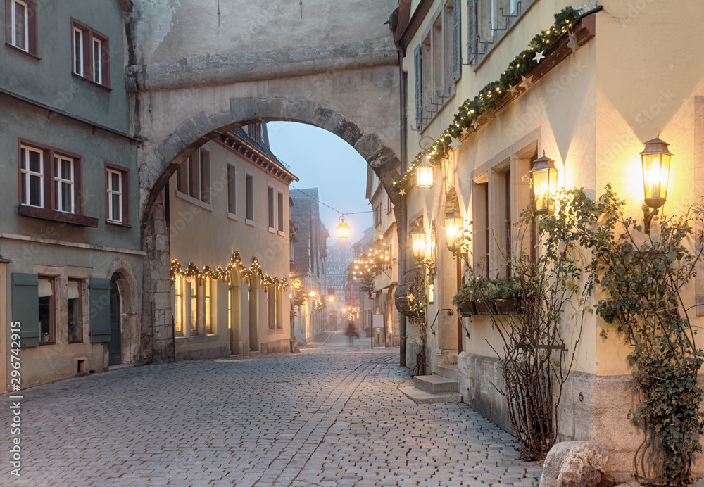 Christmas decorated street in Rothenburg ob der Tauber at winter morning, Bavaria, Germany.