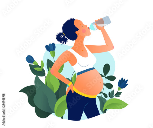 Fotografia Young pregnant beautiful woman drinking water after training