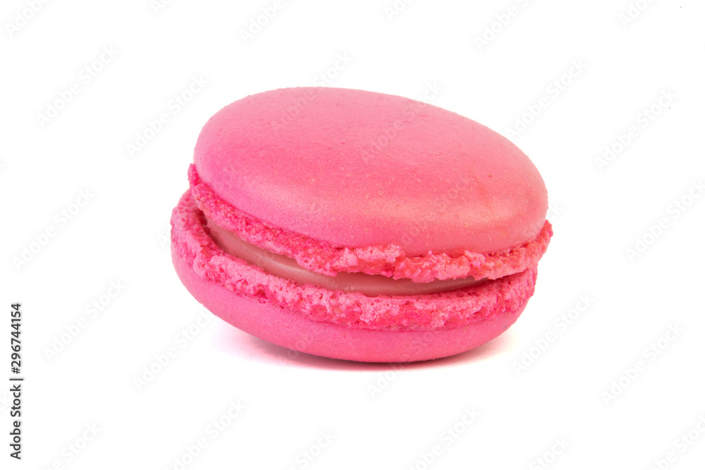 Pink macaroon coockie isolatd laying on a table. Pink macaroon coockie isolatd laying on a table.