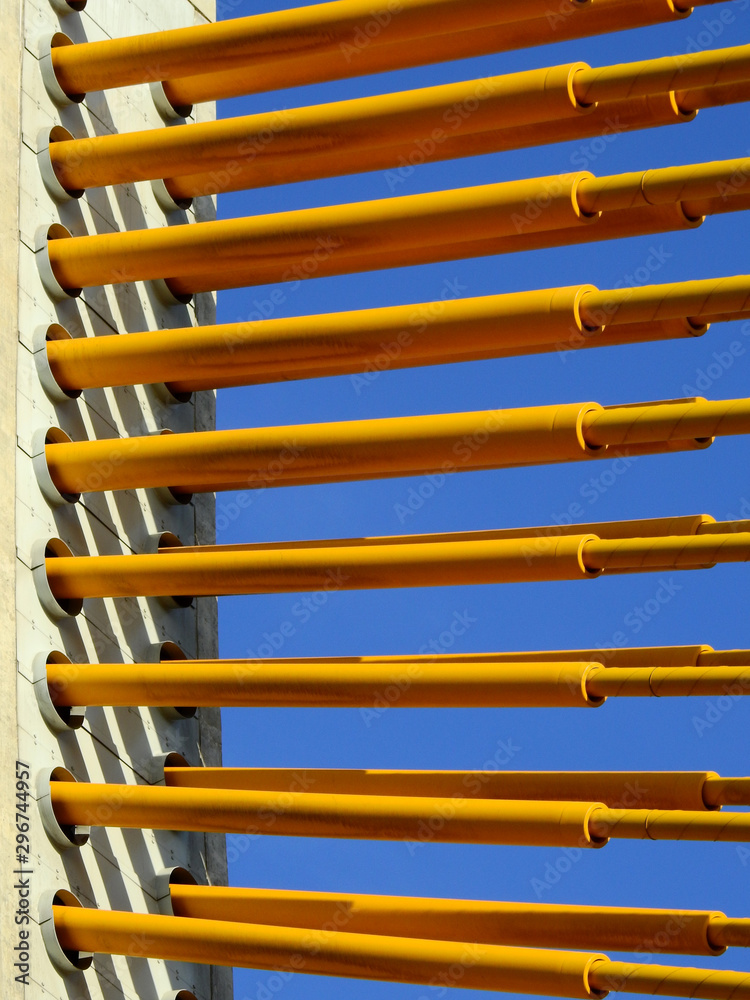 yellow sling of bridge with blue sky background