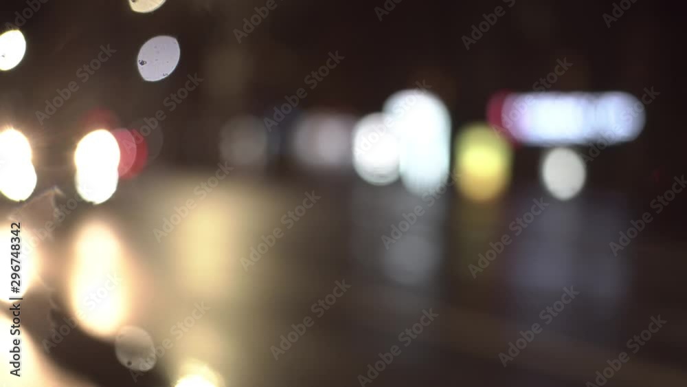 Time lapse view of night traffic on avenue of cars, in rainy times, defocus, bokeh. Time lapse view of night traffic on avenue of cars, in rainy times, defocus, bokeh.