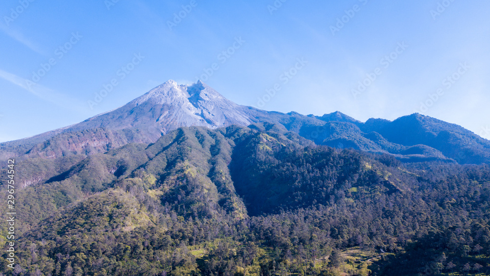 Aerial view of beautiful Merapi Mountain with the village below it in Yogyakarta, Indonesia
