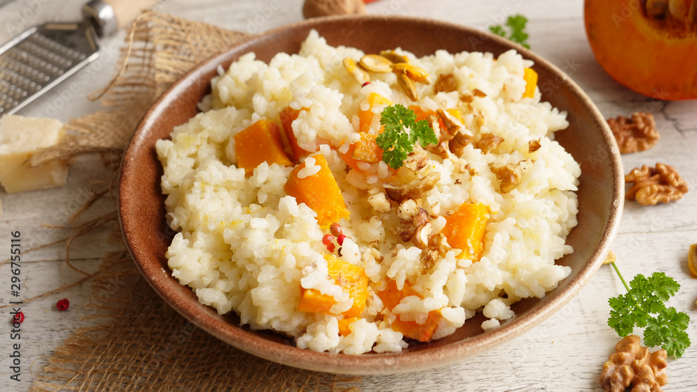 pumpkin risotto with walnut and cheese, top view pumpkin risotto with walnut and cheese, top view