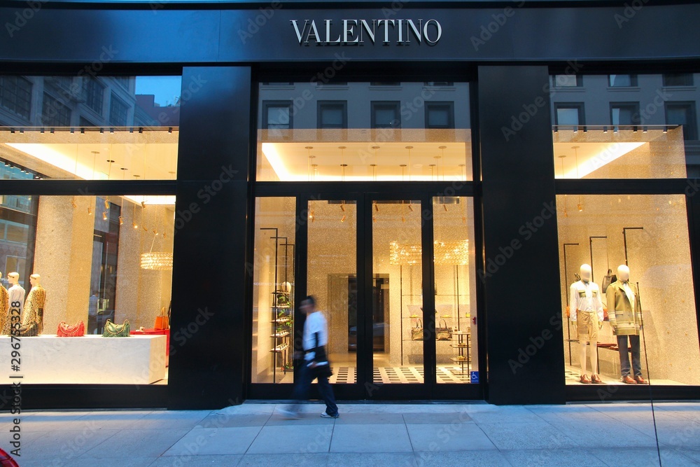 SAN FRANCISCO, USA - APRIL 8, 2014: Person walks by Valentino fashion store in San Valentino is present in 90 countries with at least 248 stores. Stock Photo | Adobe Stock