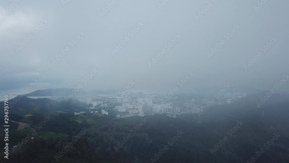 Aerial view the Sungai Ara town from foggy sky and green forest. Aerial view the Sungai Ara town from foggy sky and green forest.