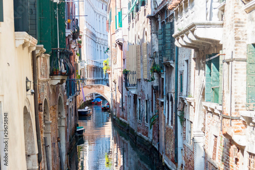 Narrow canal in old town of Venice - Italy