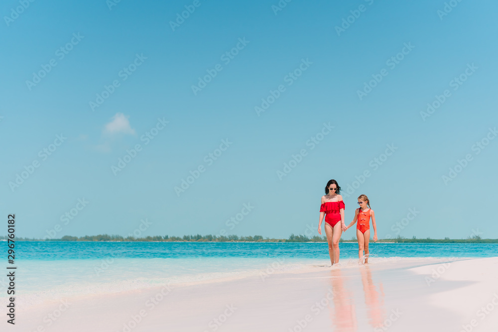 Beautiful mother and daughter on Caribbean beach Beautiful mother and daughter on Caribbean beach