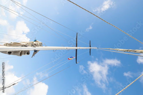 Bild auf Leinwand Sailing boat main mast with two flags