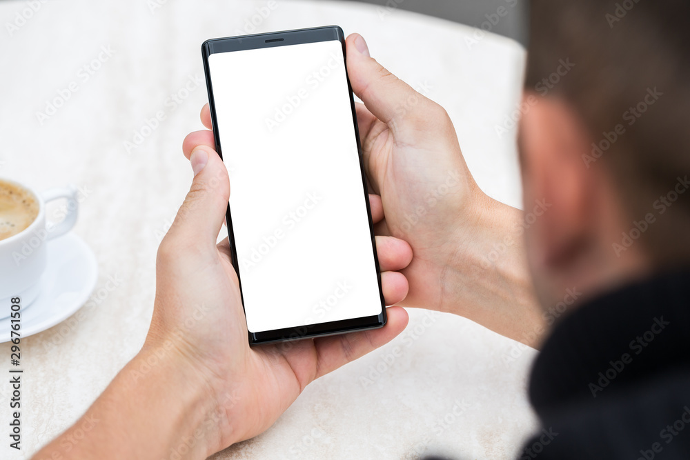 Close up of man's hands holding mobile smart phone. Close up of man's hands holding mobile smart phone.