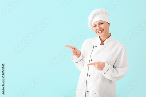 Beautiful female chef point...