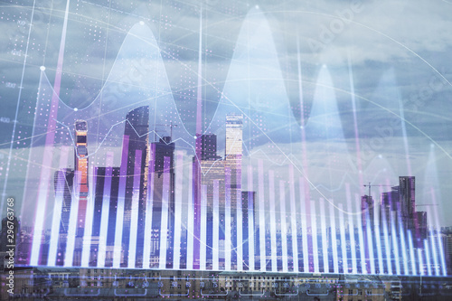 Multi exposure of financial chart on Moscow city downtown background. Concept of stock market analysis