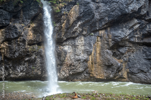 Charming scene of small waterfall with rock wall in Aare gorge (Aareschlucht) for background, Meiringen ,Switzerland photo