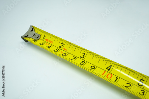 Yellow measuring tape isolated cut out on white background
