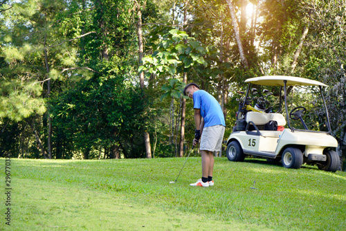 Golfer playing golf in beautiful golf course in the evening golf course