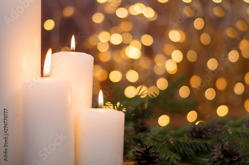 Tree branches  cones  bokeh lights  candles. Preparation for the New year