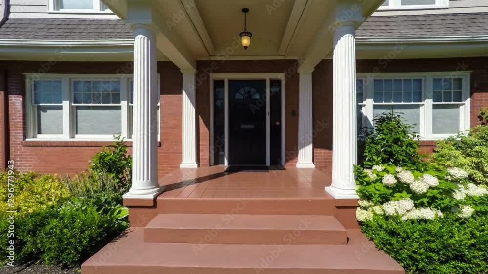 Departing from an American suburban colonial style home; dolly shot Departing from an American suburban colonial style home; dolly shot
