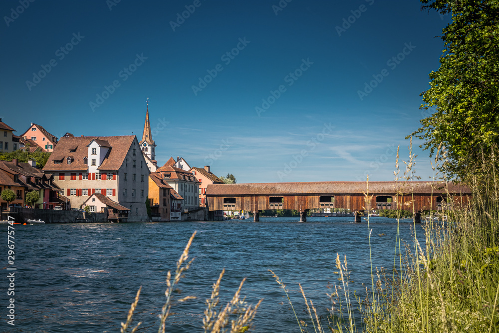 View of Diessenhofen town in Switzerland which is connected to germany by a covered wooden bridge over river Rhein