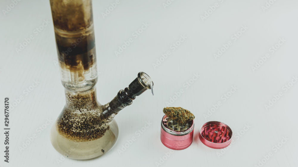 Mainstream Cursed doorway Close-up of dirty bong and grinder with medical marijuana buds on the white  table. Smoking cannabis with water pipe. Stock Photo | Adobe Stock
