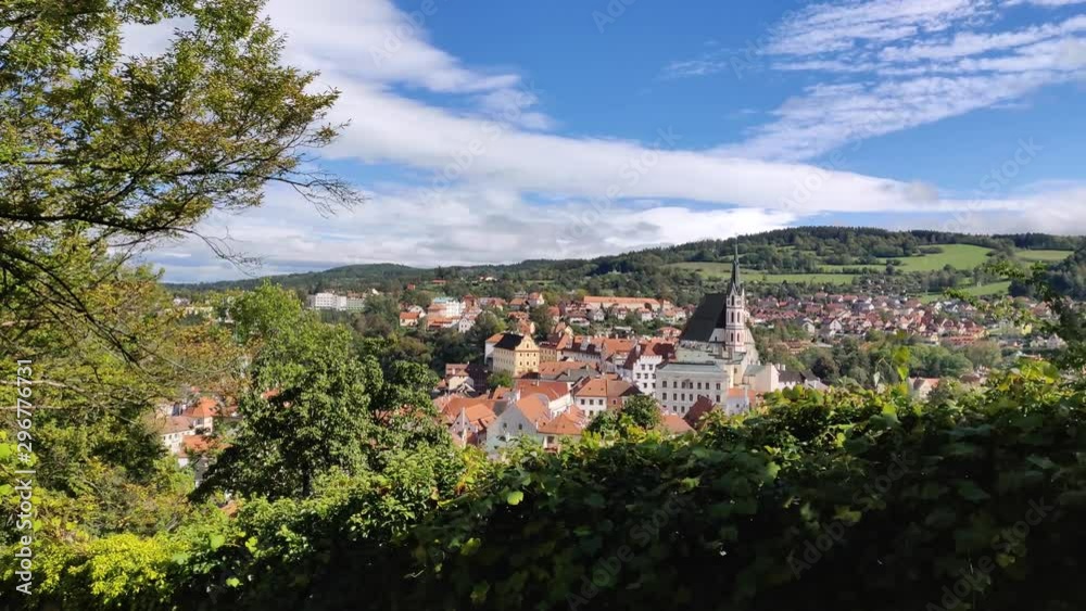 Awesome view of lovely Krumlov city, Czech republic, with dark church tower Awesome view of lovely Krumlov city, Czech republic, with dark church tower
