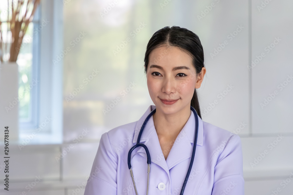 Portrait of a smiling asian nurse looking camera Portrait of a smiling asian nurse looking camera