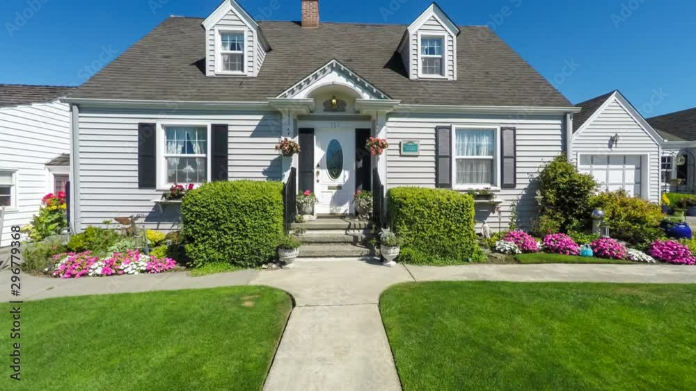 Quaint American suburban home; departing dolly shot