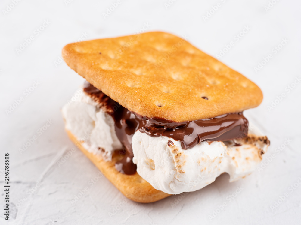 S'more on a gray surface with flowing chocolate. S'more on a gray surface with flowing chocolate.