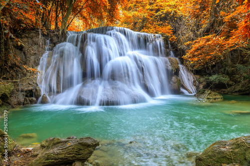 Fototapeta Naklejka Na Ścianę i Meble -  Beautiful and colorful waterfall in deep forest during idyllic autumn