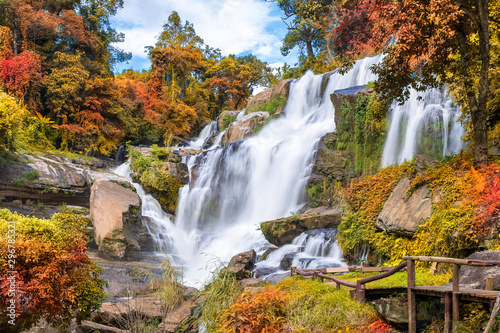 Fototapeta Naklejka Na Ścianę i Meble -  Colorful majestic waterfall in national park forest during autumn