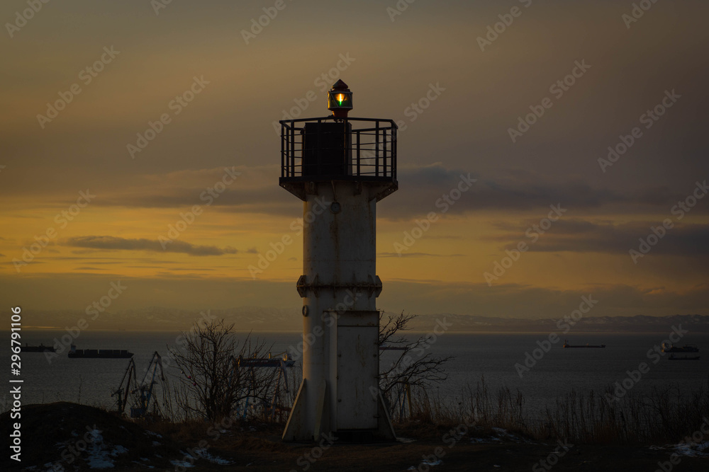 small lighthouse and ships on a background small lighthouse and ships on a background