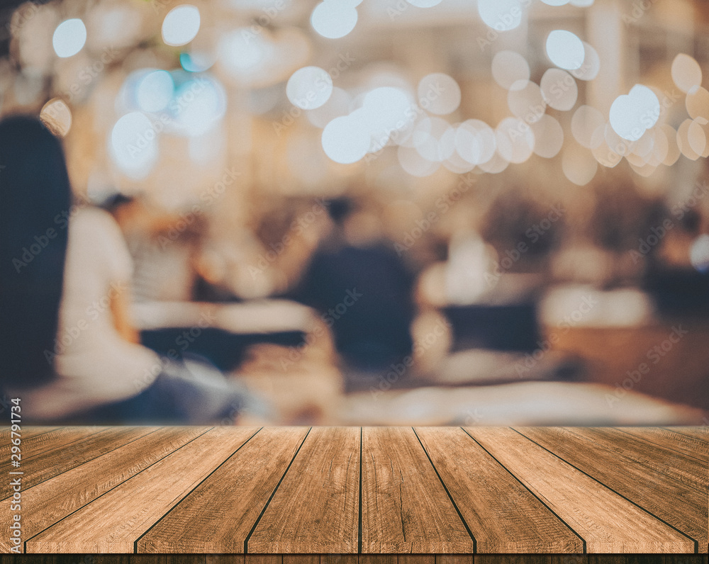wooden table in front of abstract blurred restaurant lights background wooden table in front of abstract blurred restaurant lights background