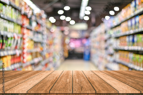 Fototapeta Empty top wooden table with supermarket blur background