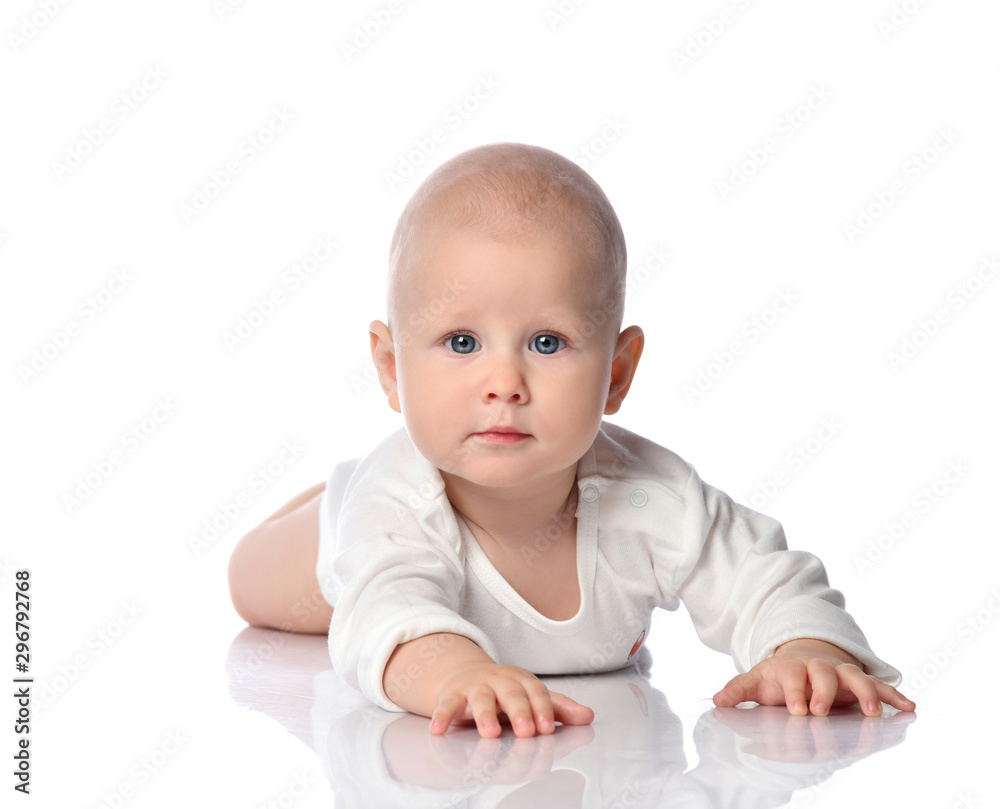 Curious child baby toddler in white bodysuit is crawling our way, holding out his hand towards us on white Curious child baby toddler in white bodysuit is crawling our way, holding out his hand towards us on white