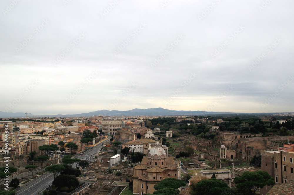 View of Colosseum and Roman Forum in Rome, Ilaly  from monument of Vittorio Emanuele (Vittoriano) observation deck. Rome cityscape from viewpoint. Travel photography.