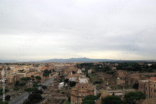View of Colosseum and Roman Forum in Rome, Ilaly from monument of Vittorio Emanuele (Vittoriano) observation deck. Rome cityscape from viewpoint. Travel photography.