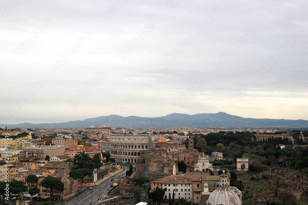 View of Colosseum and Roman Forum in Rome, Ilaly from monument of Vittorio Emanuele Vittoriano observation deck. Rome cityscape from viewpoint. Travel photography.