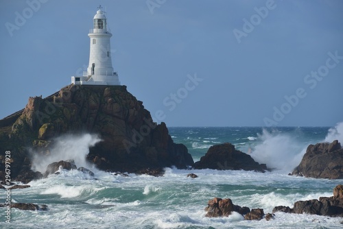 La Corbiere point, Jersey, U.K. Lighthouse with storm from the Atlantic in Autumn.