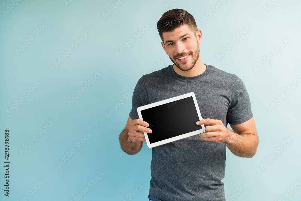 Attractive Young Male Showing Wireless Technology Attractive Young Male Showing Wireless Technology