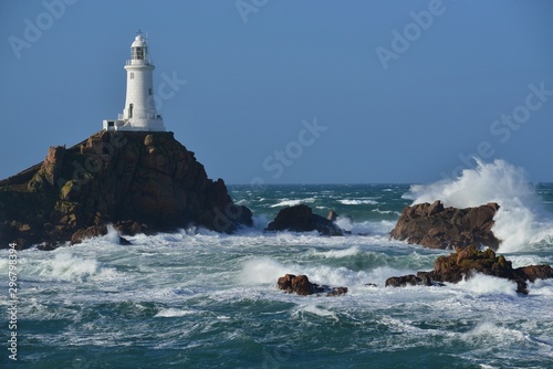 Corbiere lighthouse, Jersey, U.K. Atlantic storm around landmark.