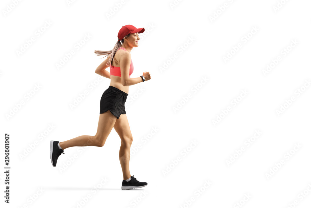 Young woman with a cap running