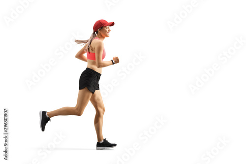 Young woman with a cap running