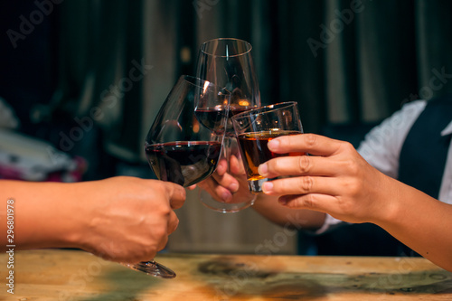 hands holding a glass of wine