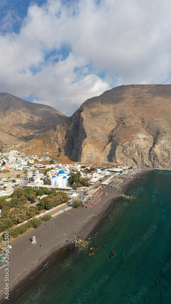 Aerial drone photo of famous volcanic beach and bay of Perissa village, Santorini island, Cyclades, Greece Aerial drone photo of famous volcanic beach and bay of Perissa village, Santorini island, Cyclades, Greece