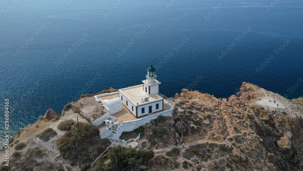 Fototapeta premium Aerial drone photo of iconic lighthouse of Akrotiri near Akrotiri village, Santorini island, Cyclades, Greece