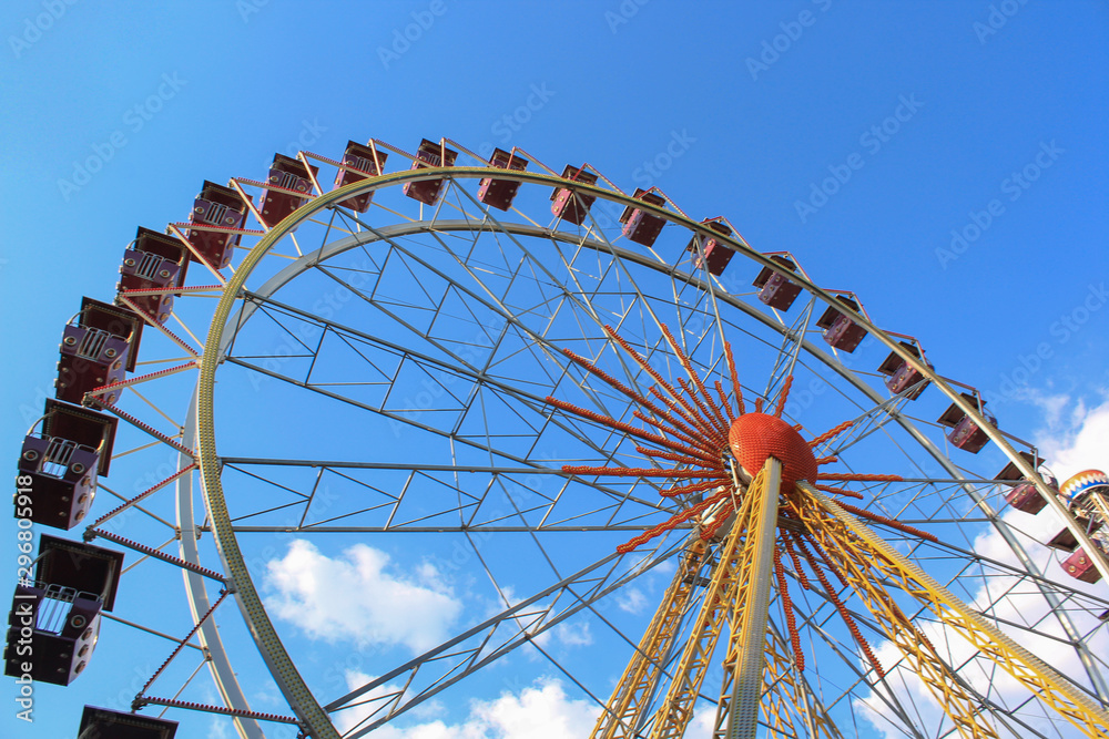 Ferris wheel over cloudy sky without people Ferris wheel over cloudy sky without people