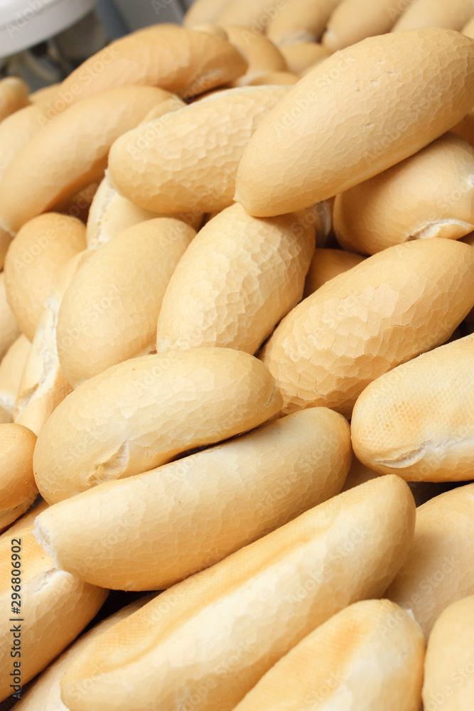 Wholemeal bread sticks fresh from the oven in a bakery Wholemeal bread sticks fresh from the oven in a bakery